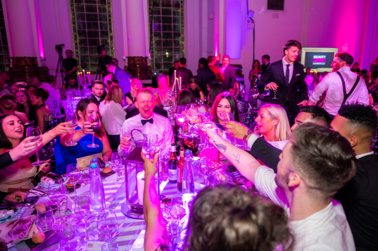 People cheers and have dinner at the UK Beauty Awards